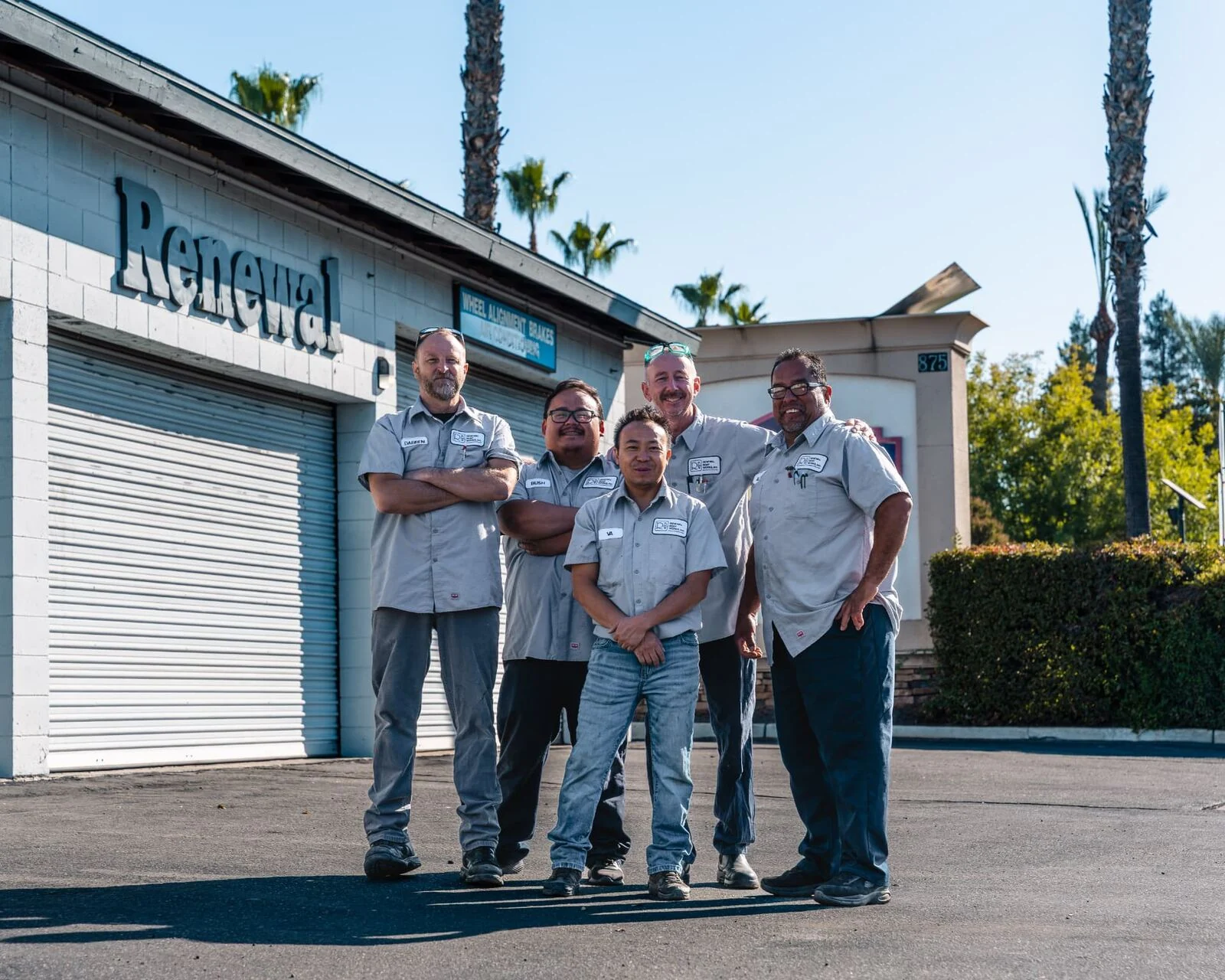 Renewal Body Works body and mechanical technicians in front of the Clovis shop